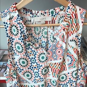 Mosaic, ruffle neck, shell top.